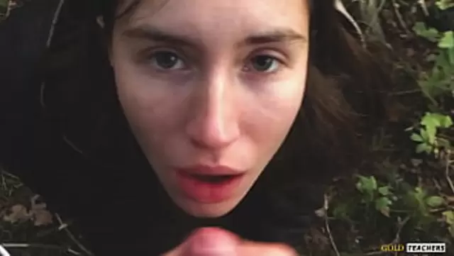 Russian girl sucks her friend's cock in the woods